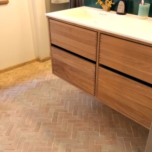 Bejmat-herringbone-tiles-natural-unglazed Authentic handmade unglazed Bejmat tiles in natural terracotta. Rustic 4,5x14 cm tiles from Fez, Morocco – timeless warmth with unique artisan texture.