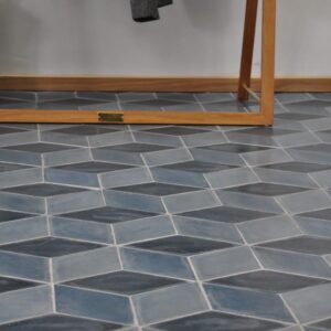 Diamond-shaped handmade encaustic cement tile in soft Nordic colors. Durable, contemporary, and perfect for unique walls or floors.