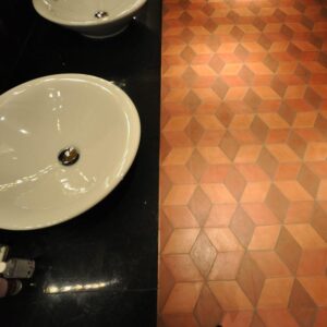 Diamond-shaped handmade encaustic cement tile in soft Nordic colors. Durable, contemporary, and perfect for unique walls or floors.