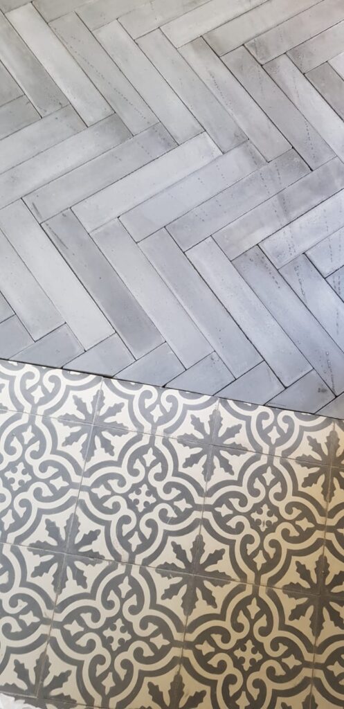 This handmade encaustic cement tile in contemporary style brings timeless elegance to your interior. A herringbone shape in Nordic color
