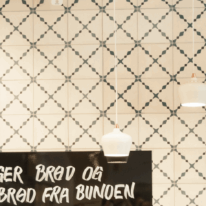 This handmade encaustic cement tile in classic style brings timeless elegance to your interior. A refined elegant pattern in Nordic colors.