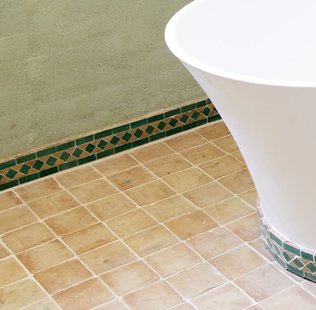 Authentic handmade unglazed Zellige tiles in natural terracotta. Rustic 10x10 cm tiles from Fez, Morocco – timeless warmth with unique artisan texture.