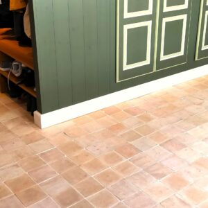 Authentic handmade unglazed Zellige tiles in natural terracotta. Rustic 15x15 cm tiles from Fez, Morocco – timeless warmth with unique artisan texture.