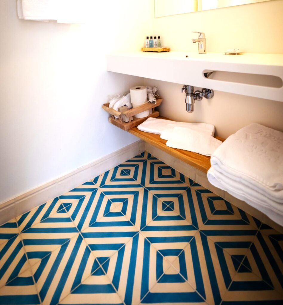 This handmade encaustic cement tile in contemporay style brings timeless elegance to your interior. A refined geometric pattern in Nordic colors.