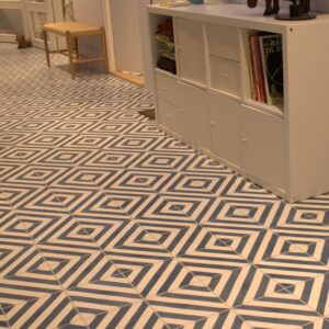 This handmade encaustic cement tile in contemporay style brings timeless elegance to your interior. A refined geometric pattern in Nordic colors.