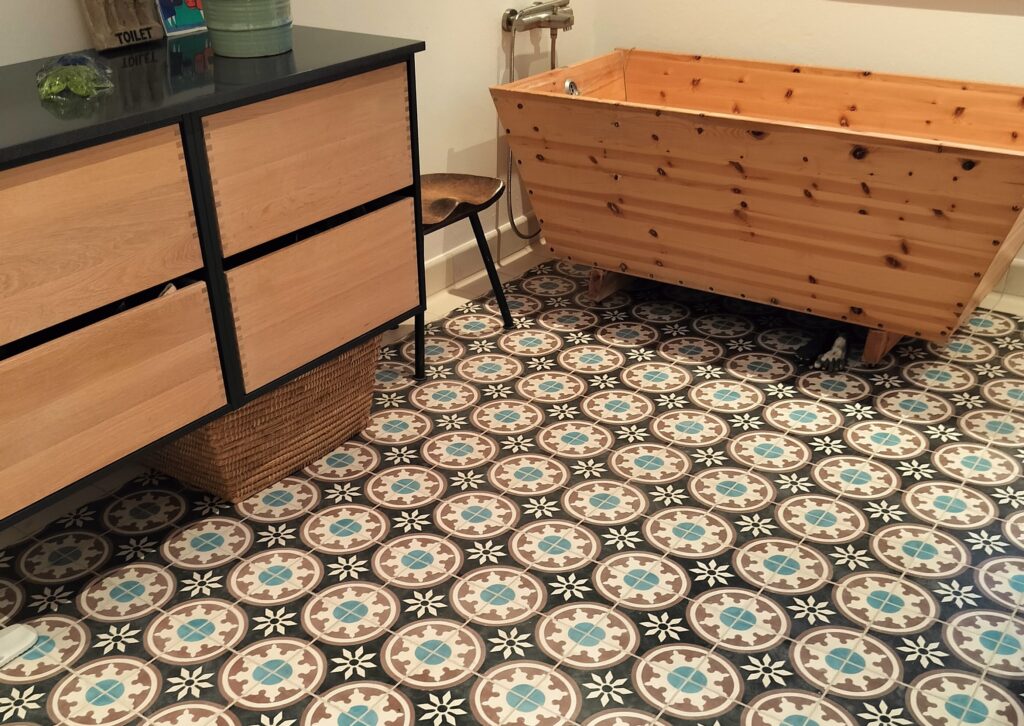 This handmade encaustic cement tile in classic style brings timeless elegance to your interior. A refined European pattern in Nordic colors.