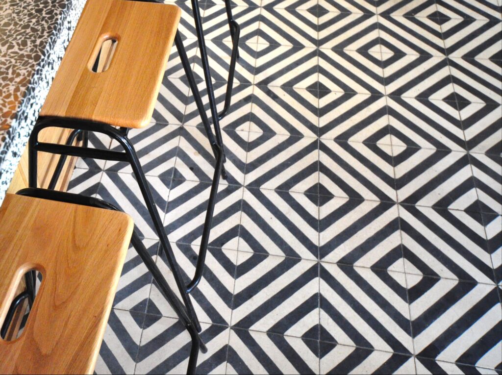This handmade encaustic cement tile in contemporay style brings timeless elegance to your interior. A refined geometric pattern in Nordic colors.