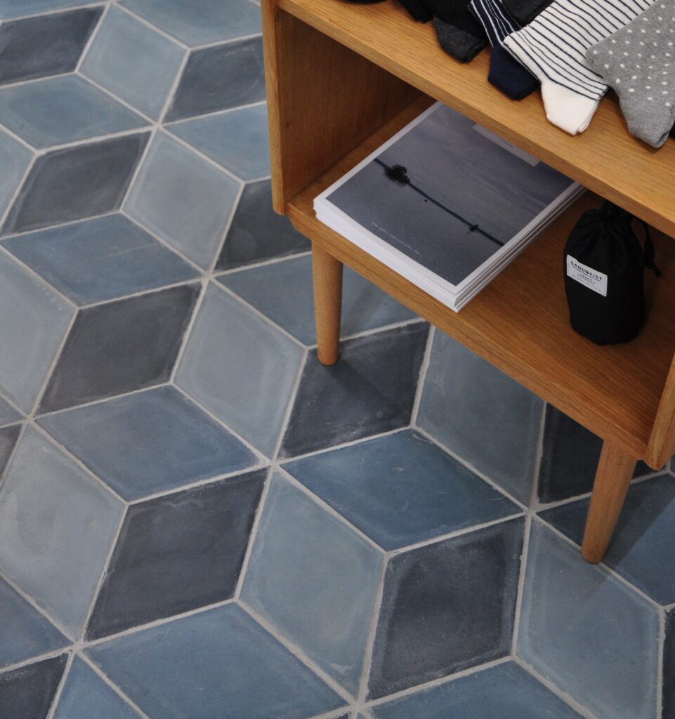 Diamond-shaped handmade encaustic cement tiles in soft Nordic colors. Durable, contemporary, and perfect for unique walls or floors.