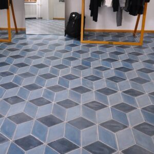 Diamond-shaped handmade encaustic cement tile in soft Nordic colors. Durable, contemporary, and perfect for unique walls or floors.