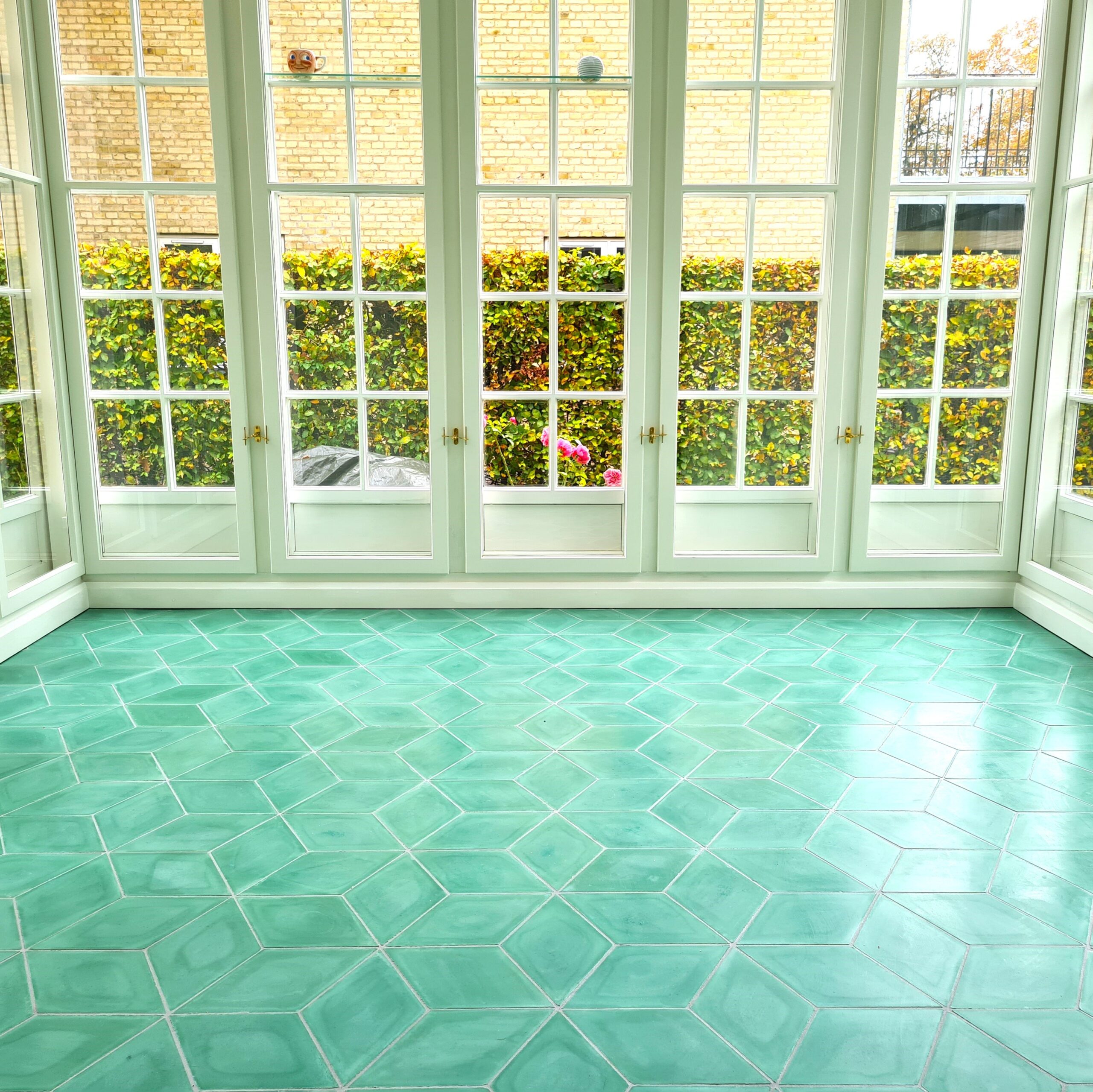 Handmade encaustic cement tiles in diamond shape and beautiful ocean green color - made by Villa Tiles.