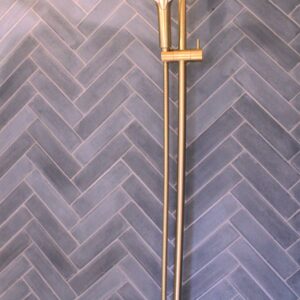 This handmade encaustic cement tile in contemporary style brings timeless elegance to your interior. A herringbone shape in Nordic colors.
