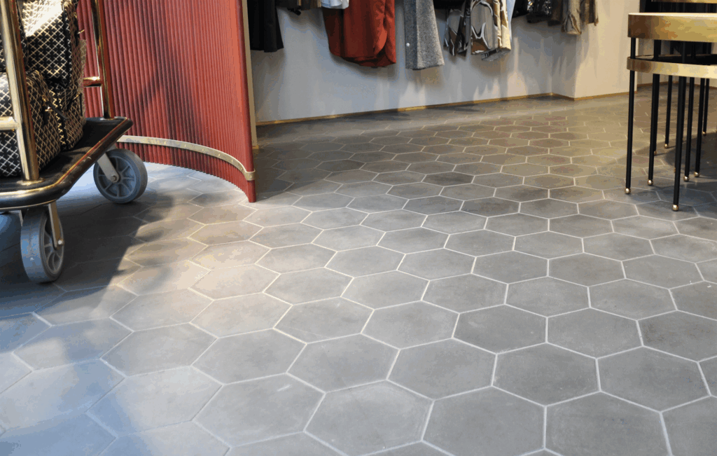 This handmade encaustic cement tile in classic style brings timeless elegance to your interior. An hexagon shape in Nordic colors.