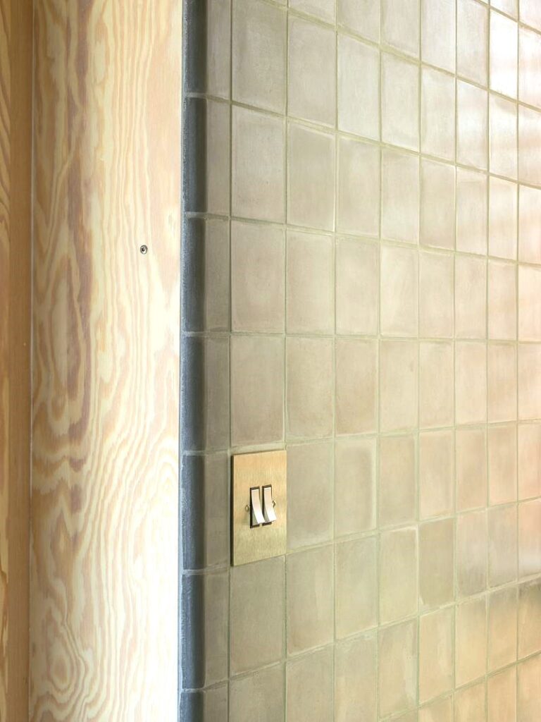 Discover handmade edge tiles in marble-cement — elegant curved tiles for seamless wall to wall transitions, crafted in Danish design.
