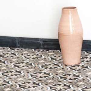 Discover handmade plinth tiles in marble-cement — elegant waved tiles for seamless floor to wall transitions, crafted in a timeless shape.