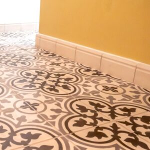 Discover handmade plinth tiles in marble-cement — elegant waved tiles for seamless floor to wall transitions, crafted in a timeless shape.