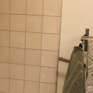 Discover handmade edge tiles in marble-cement — elegant curved tiles for seamless wall to wall transitions, crafted in Danish design.