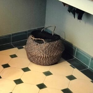 Discover handmade plinth tiles in marble-cement — elegant waved tiles for seamless floor to wall transitions, crafted in a timeless shape.